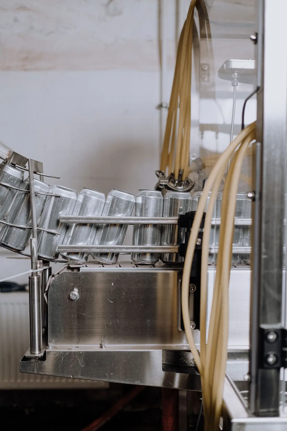 Empty cans moving along a canning line
